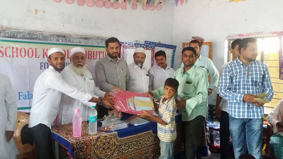 A student receiving school supplies from Pen Foundation volunteers